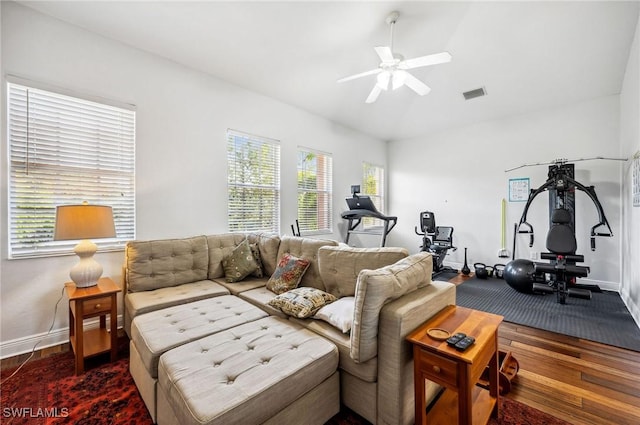 living room with hardwood / wood-style flooring and ceiling fan