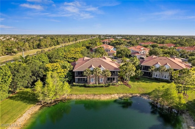 bird's eye view featuring a water view and a wooded view