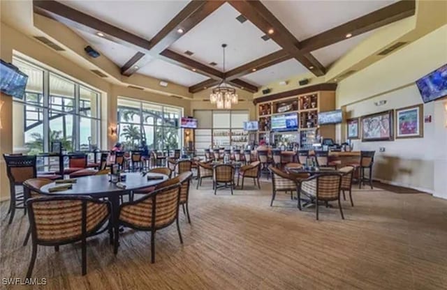 dining area with a towering ceiling, beamed ceiling, coffered ceiling, and a notable chandelier