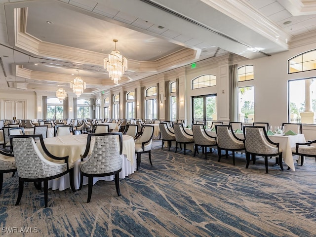 dining space with a chandelier, dark carpet, and ornamental molding