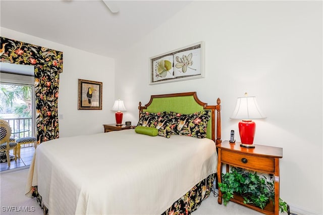 bedroom featuring light carpet