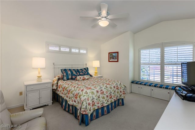 carpeted bedroom featuring ceiling fan and lofted ceiling