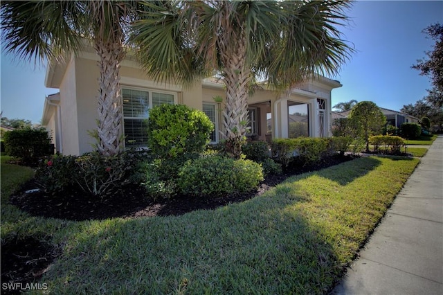 exterior space featuring a front lawn