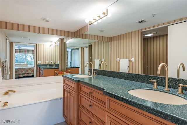 bathroom featuring vanity and a bathtub