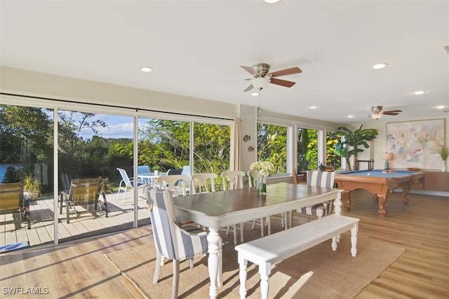 dining area with pool table, ceiling fan, a wealth of natural light, and light hardwood / wood-style flooring