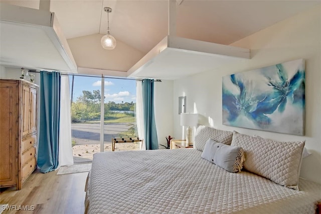 bedroom featuring light wood-type flooring, access to outside, and expansive windows