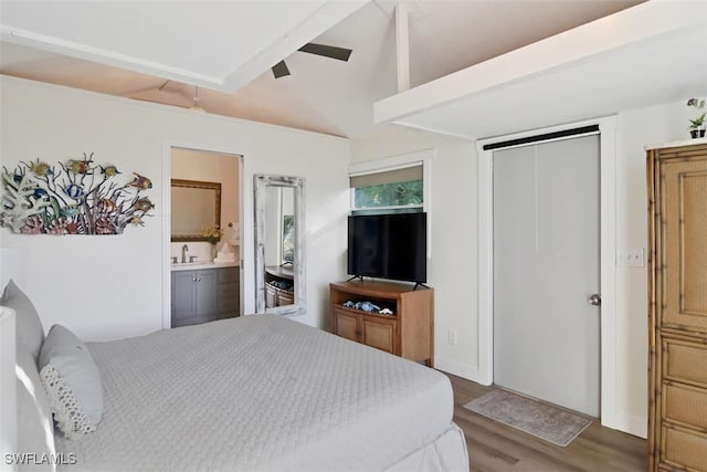 bedroom with sink, ceiling fan, hardwood / wood-style flooring, a closet, and ensuite bath