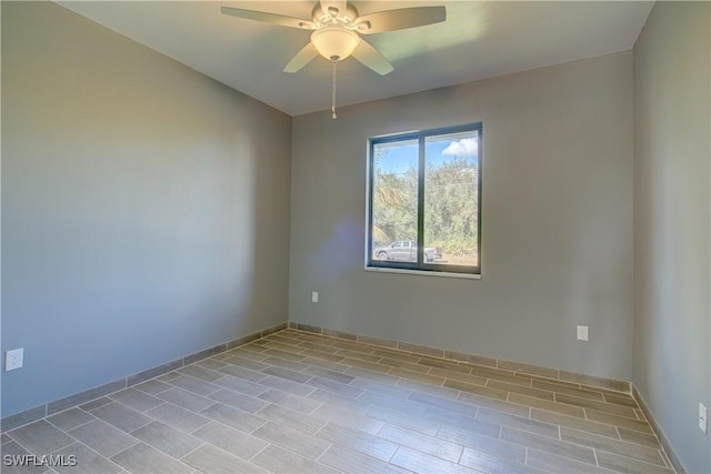 spare room with ceiling fan