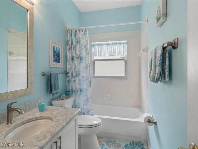 full bathroom with vanity, toilet, and shower / tub combo