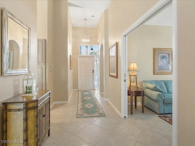 hall with light tile patterned floors