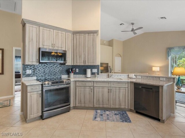 kitchen with backsplash, stainless steel appliances, ceiling fan, sink, and light tile patterned floors