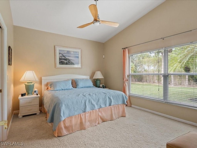 bedroom with light carpet, ceiling fan, and lofted ceiling