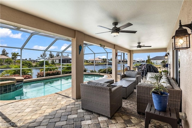 view of swimming pool featuring glass enclosure, an outdoor living space, a water view, ceiling fan, and a patio area