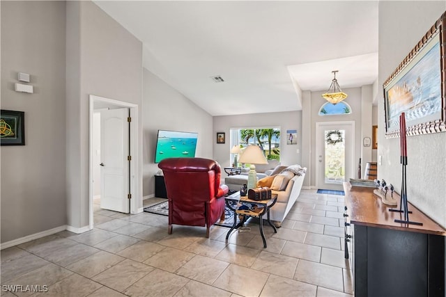 living room featuring high vaulted ceiling