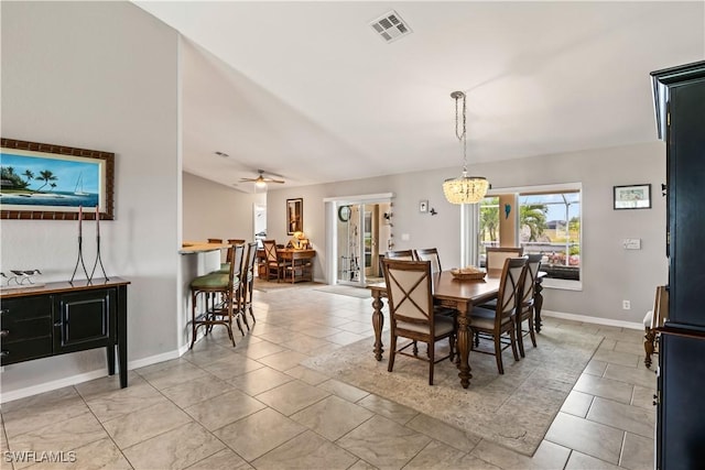 dining space featuring ceiling fan with notable chandelier and light tile patterned floors