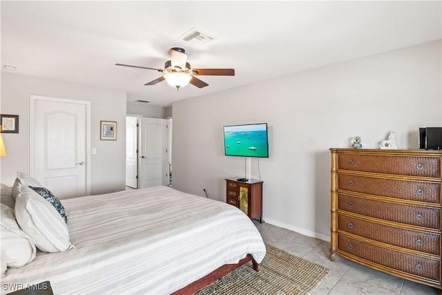 bedroom with light tile patterned floors and ceiling fan