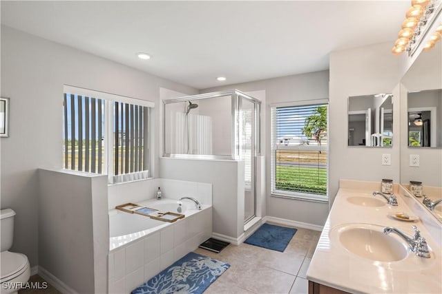 full bathroom with tile patterned flooring, vanity, toilet, and independent shower and bath