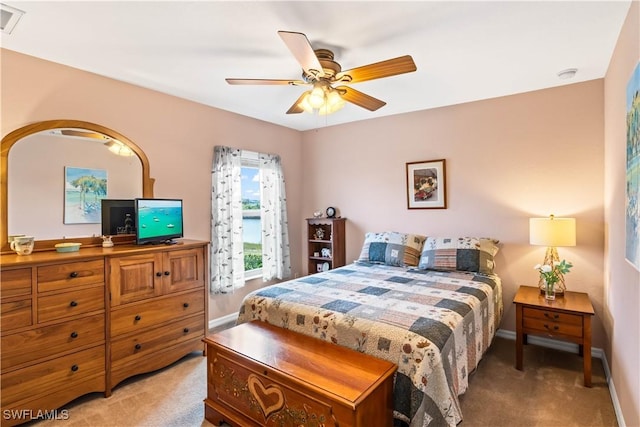 carpeted bedroom with ceiling fan