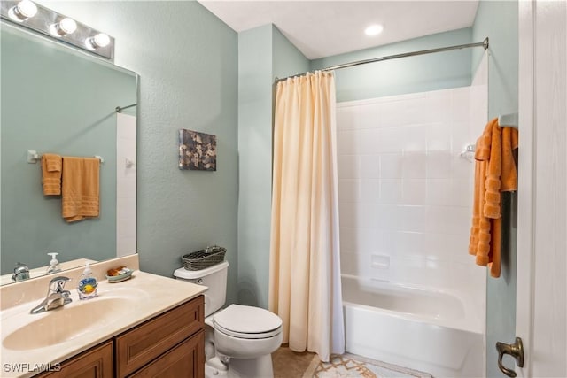 full bathroom featuring shower / tub combo with curtain, vanity, and toilet