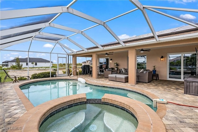 view of pool featuring outdoor lounge area, ceiling fan, a patio area, and an in ground hot tub