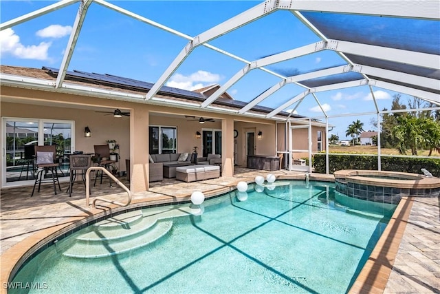 view of swimming pool with a lanai, an in ground hot tub, a patio, and an outdoor hangout area