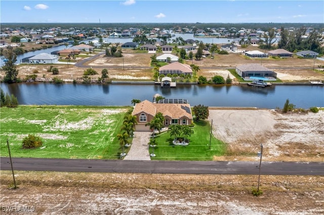 drone / aerial view with a water view