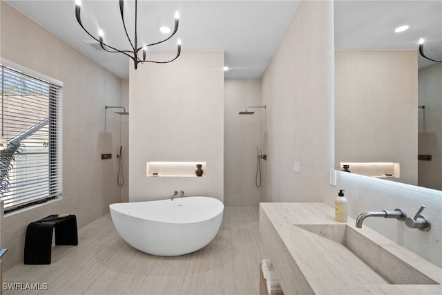 1364 Cypress Woods Dr, Naples, FL 34103 - full bathroom with a sink, a walk in shower, a soaking tub, and a chandelier