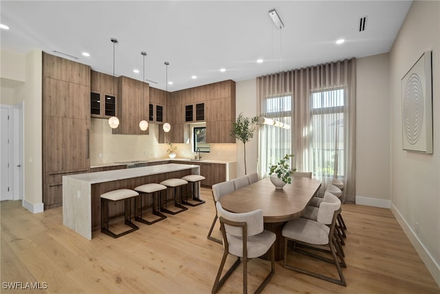 dining room with light hardwood / wood-style flooring