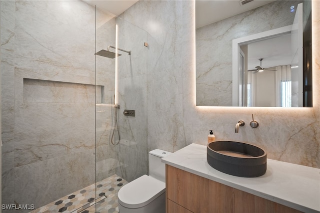 1364 Cypress Woods Dr, Naples, FL 34103 - full bathroom with tile walls, a walk in shower, toilet, vanity, and decorative backsplash