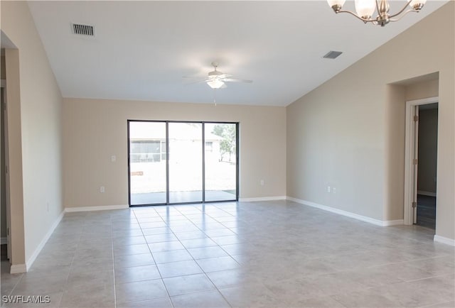 unfurnished room with ceiling fan with notable chandelier, lofted ceiling, and light tile patterned flooring