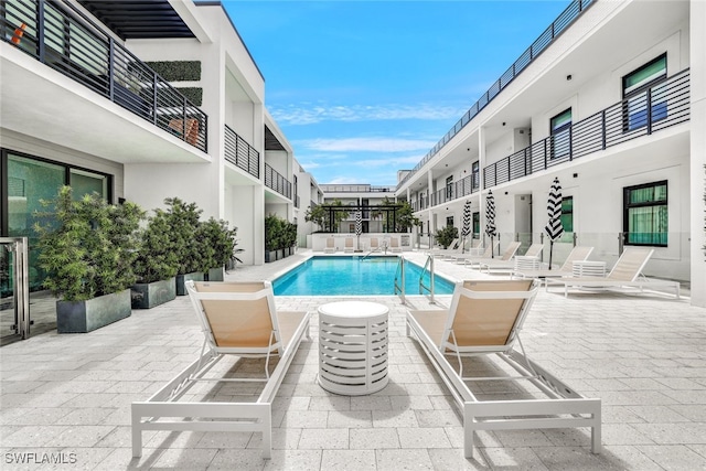 view of swimming pool with a patio area