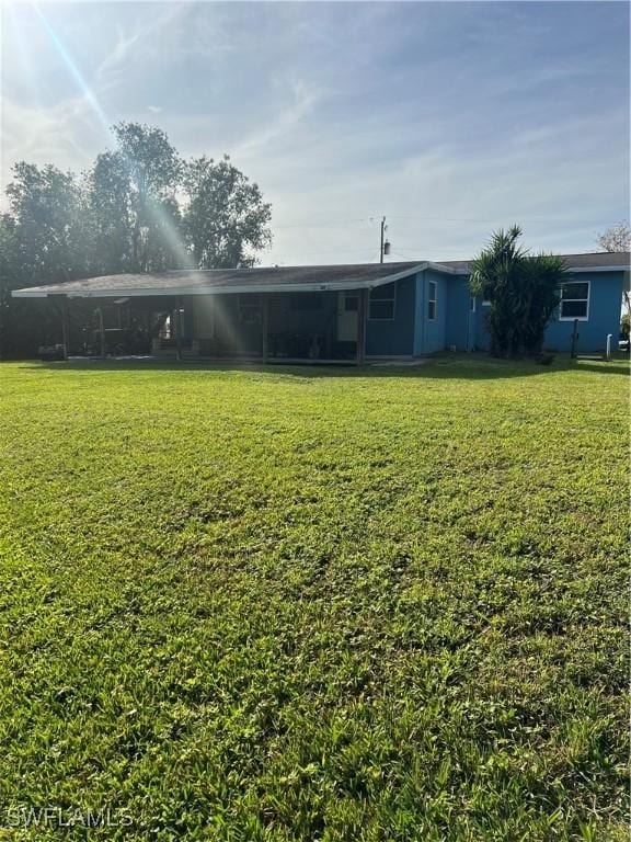 view of yard with a carport