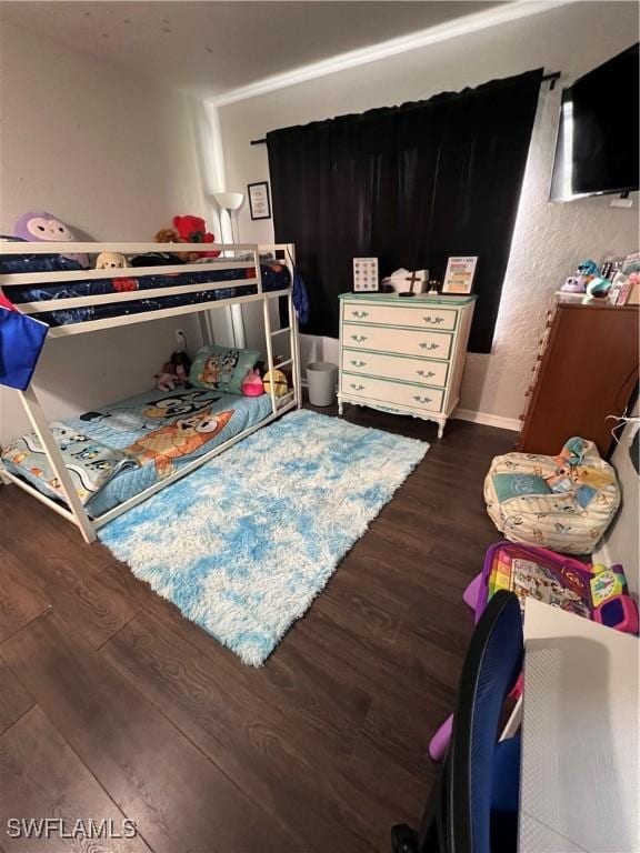 bedroom featuring dark hardwood / wood-style flooring