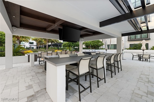 view of patio with outdoor dry bar