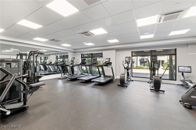 exercise room featuring visible vents and a drop ceiling