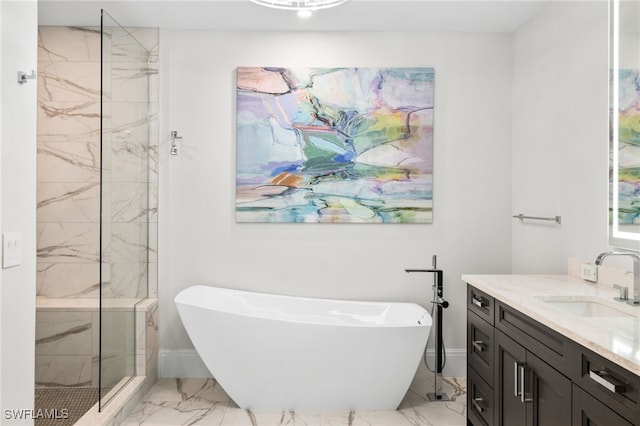 bathroom featuring marble finish floor, a marble finish shower, a soaking tub, vanity, and baseboards