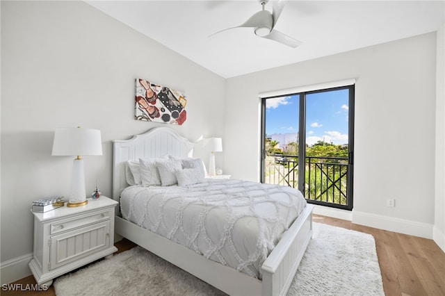 bedroom with baseboards, light wood finished floors, a ceiling fan, and access to exterior