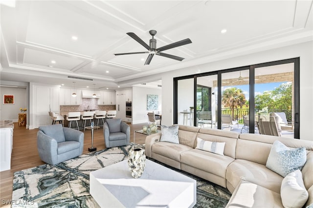 living area featuring recessed lighting, a ceiling fan, light wood-type flooring, coffered ceiling, and baseboards