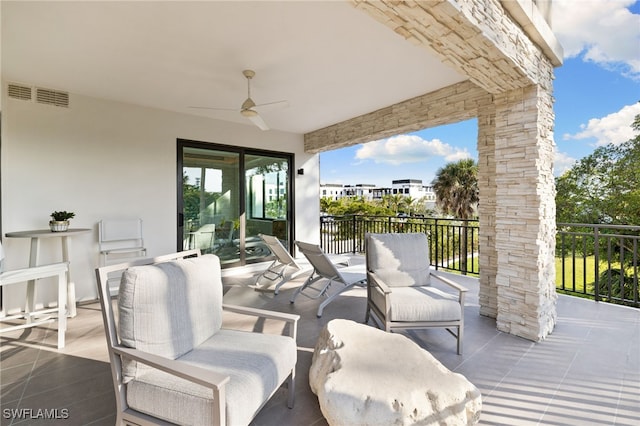 view of patio / terrace with a ceiling fan and visible vents