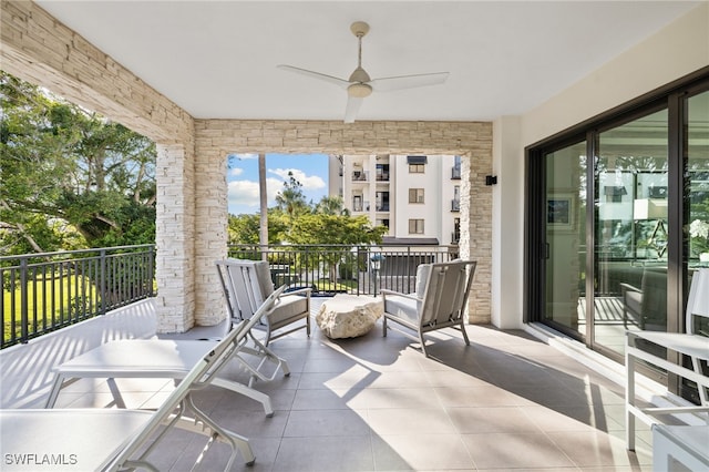 exterior space with ceiling fan