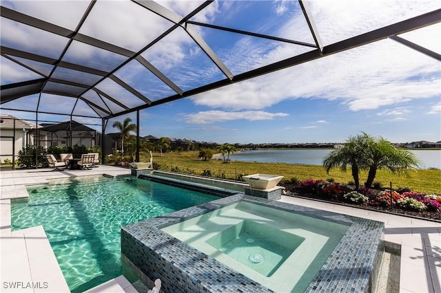 view of pool with glass enclosure, a patio area, a water view, and an in ground hot tub