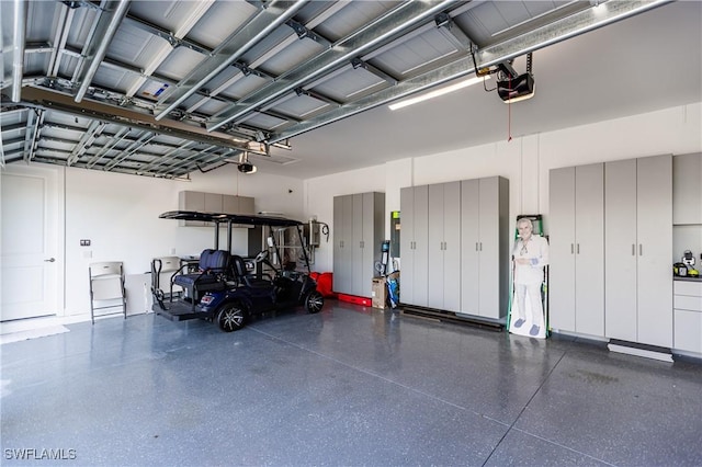 garage featuring a garage door opener