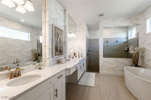 bathroom with vanity and plus walk in shower