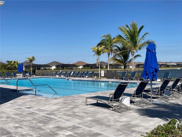 view of swimming pool featuring a patio area