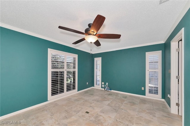 spare room featuring ceiling fan, ornamental molding, and a textured ceiling