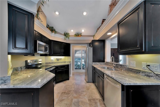 kitchen featuring sink, a tray ceiling, stainless steel appliances, kitchen peninsula, and light stone countertops