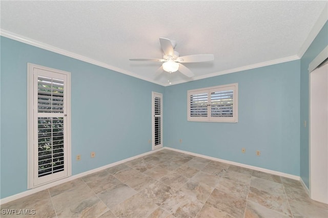 spare room featuring ceiling fan, ornamental molding, a textured ceiling, and a healthy amount of sunlight