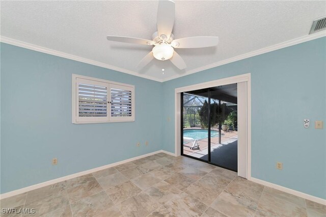 spare room with a textured ceiling, ceiling fan, and ornamental molding