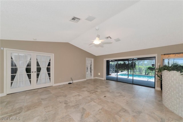 empty room with ceiling fan and lofted ceiling