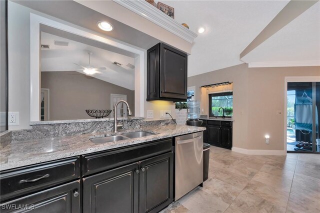 kitchen featuring dishwasher, ceiling fan, lofted ceiling, and sink